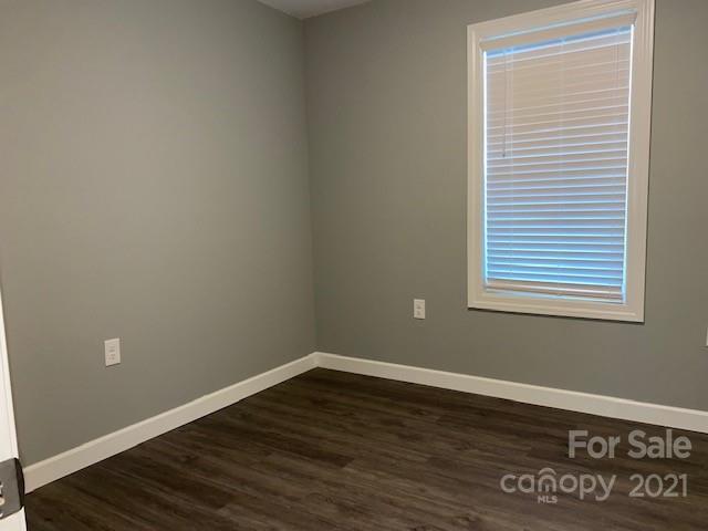 1599 Springdale Road Lancaster, SC 29720 - Photo 19 of 28 a view of a room that has wooden floor and a window