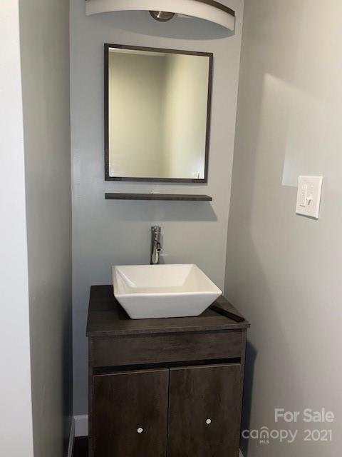 1599 Springdale Road Lancaster, SC 29720 - Photo 21 of 28 a bathroom with a sink a mirror and vanity