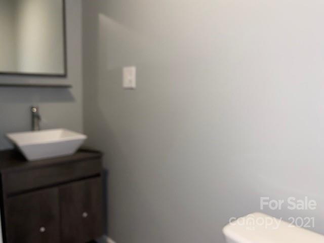 1599 Springdale Road Lancaster, SC 29720 - Photo 23 of 28 a bathroom with a sink toilet and mirror