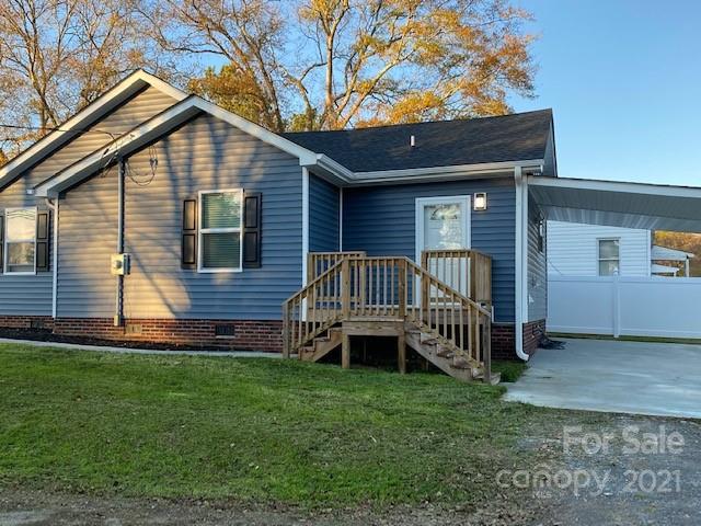 1599 Springdale Road Lancaster, SC 29720 - Photo 24 of 28 a backyard of a house with a garden and deck