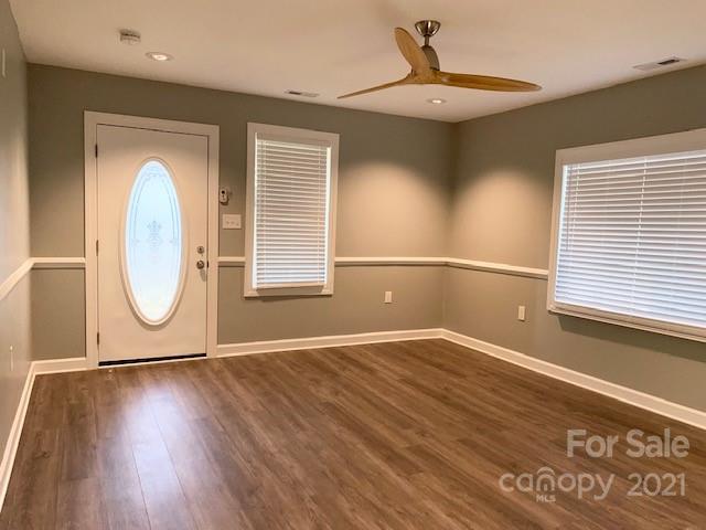 1599 Springdale Road Lancaster, SC 29720 - Photo 8 of 28 a view of an empty room with wooden floor and a window