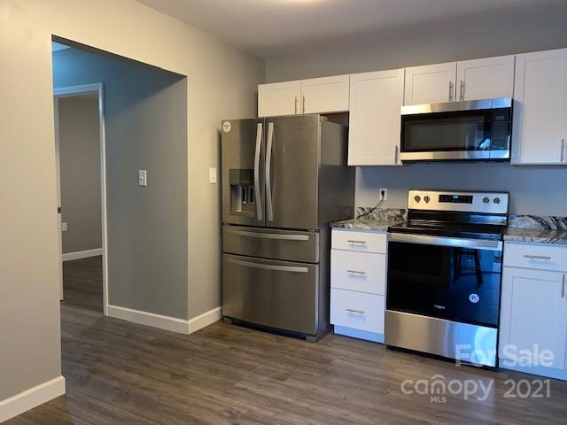 1599 Springdale Road Lancaster, SC 29720 - Photo 10 of 28 a kitchen with a refrigerator stove and microwave