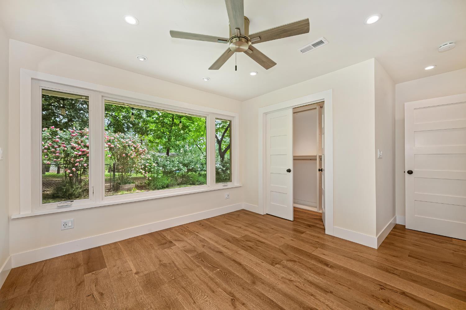 8495 Chili Hill Road Newcastle, CA 95658 - Photo 15 of 56 a view of empty room with wooden floor and fan