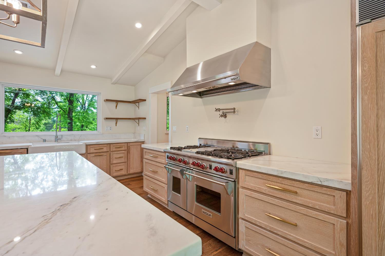 8495 Chili Hill Road Newcastle, CA 95658 - Photo 8 of 56 a kitchen with a stove and a white wooden cabinets