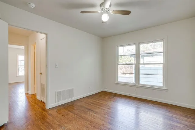 a bathroom with a sink toilet a mirror and bathtub