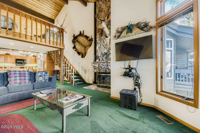 a view of a house with a yard from a balcony