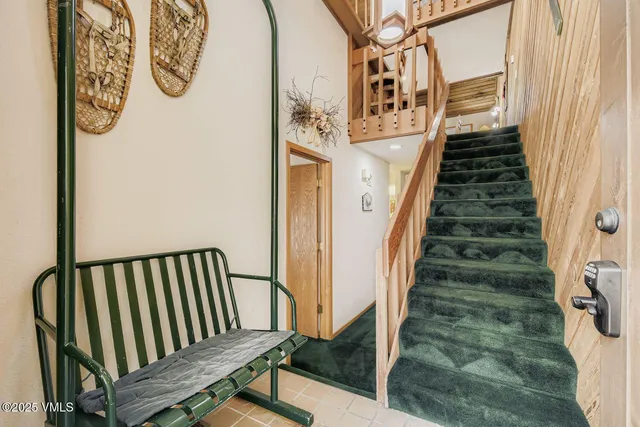 a view of stairs with wooden floor
