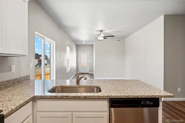 a kitchen with granite countertop a sink and a granite counter tops