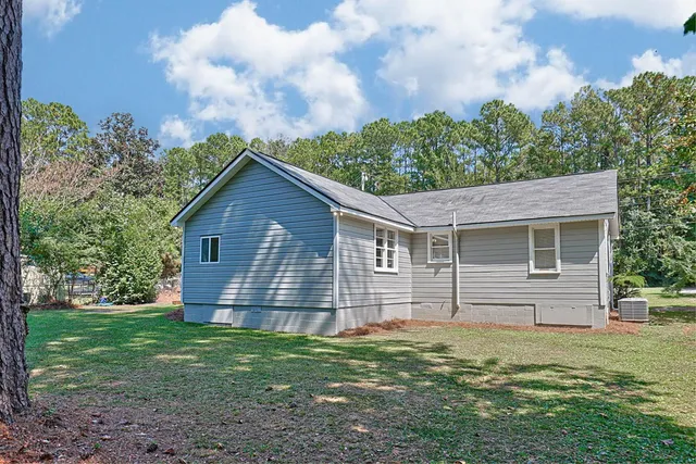 a backyard of a house with lots of green space