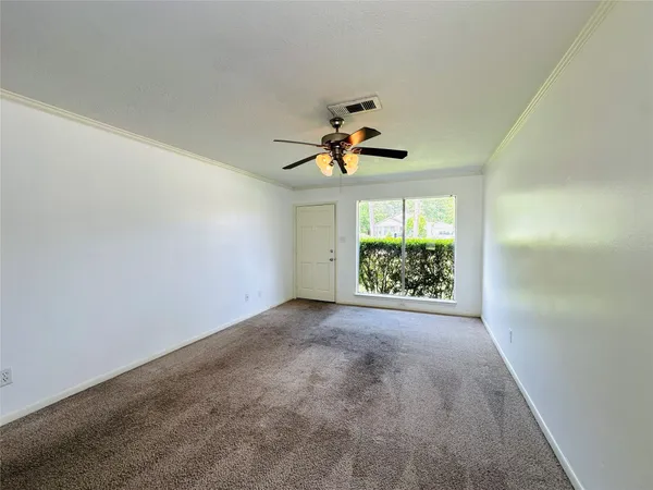 en view of room with window and ceiling fan