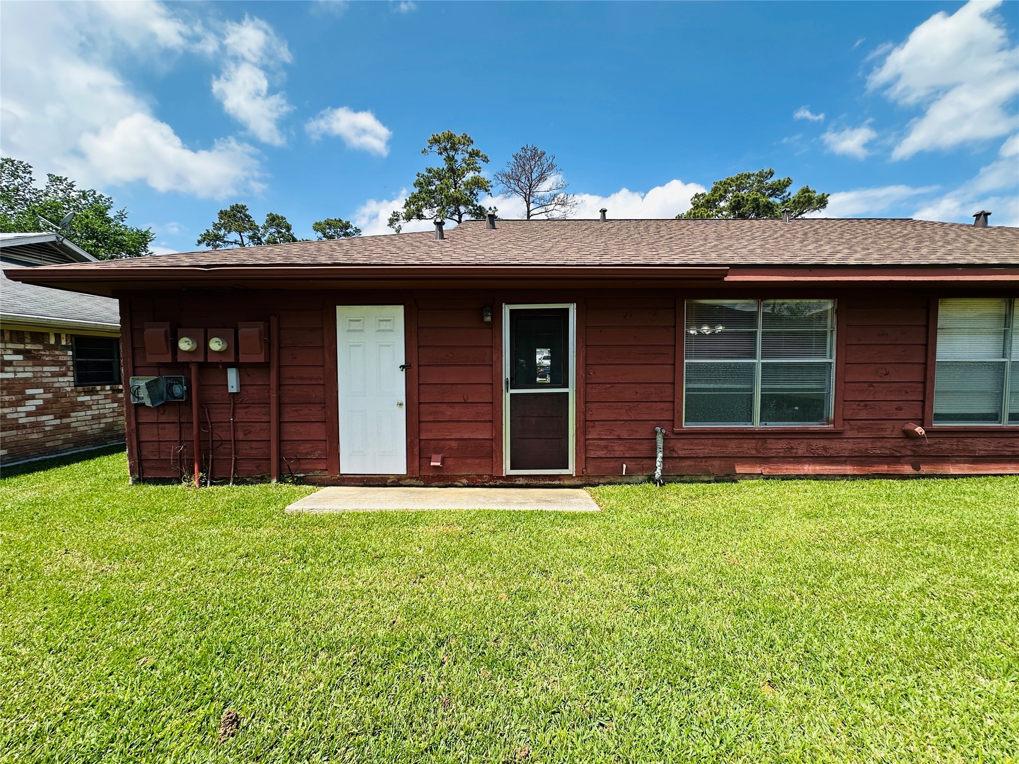 1011 Mccall Avenue Conroe, TX 77301 - Photo 14 of 15 a view of a house with a yard and garage
