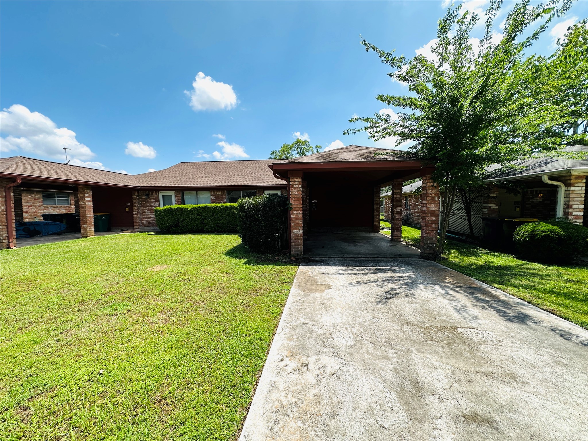 1011 Mccall Avenue Conroe, TX 77301 - Photo 15 of 15 a view of a house with a yard