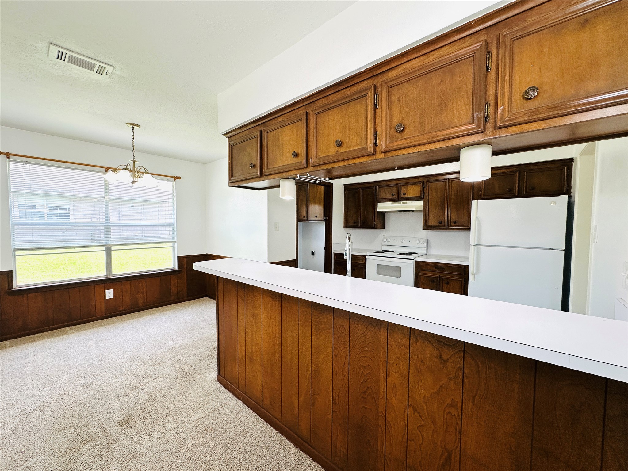 1011 Mccall Avenue Conroe, TX 77301 - Photo 4 of 15 a kitchen with stainless steel appliances a sink a stove and cabinets