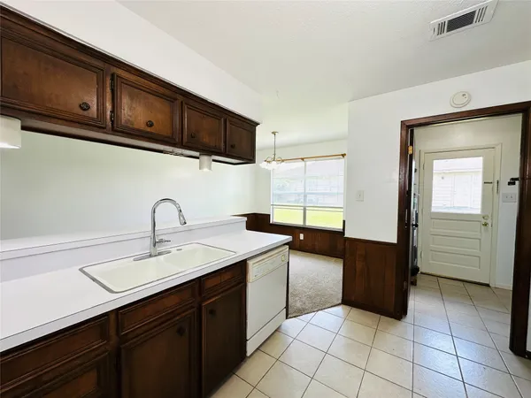 a kitchen with stainless steel appliances granite countertop a sink and cabinets