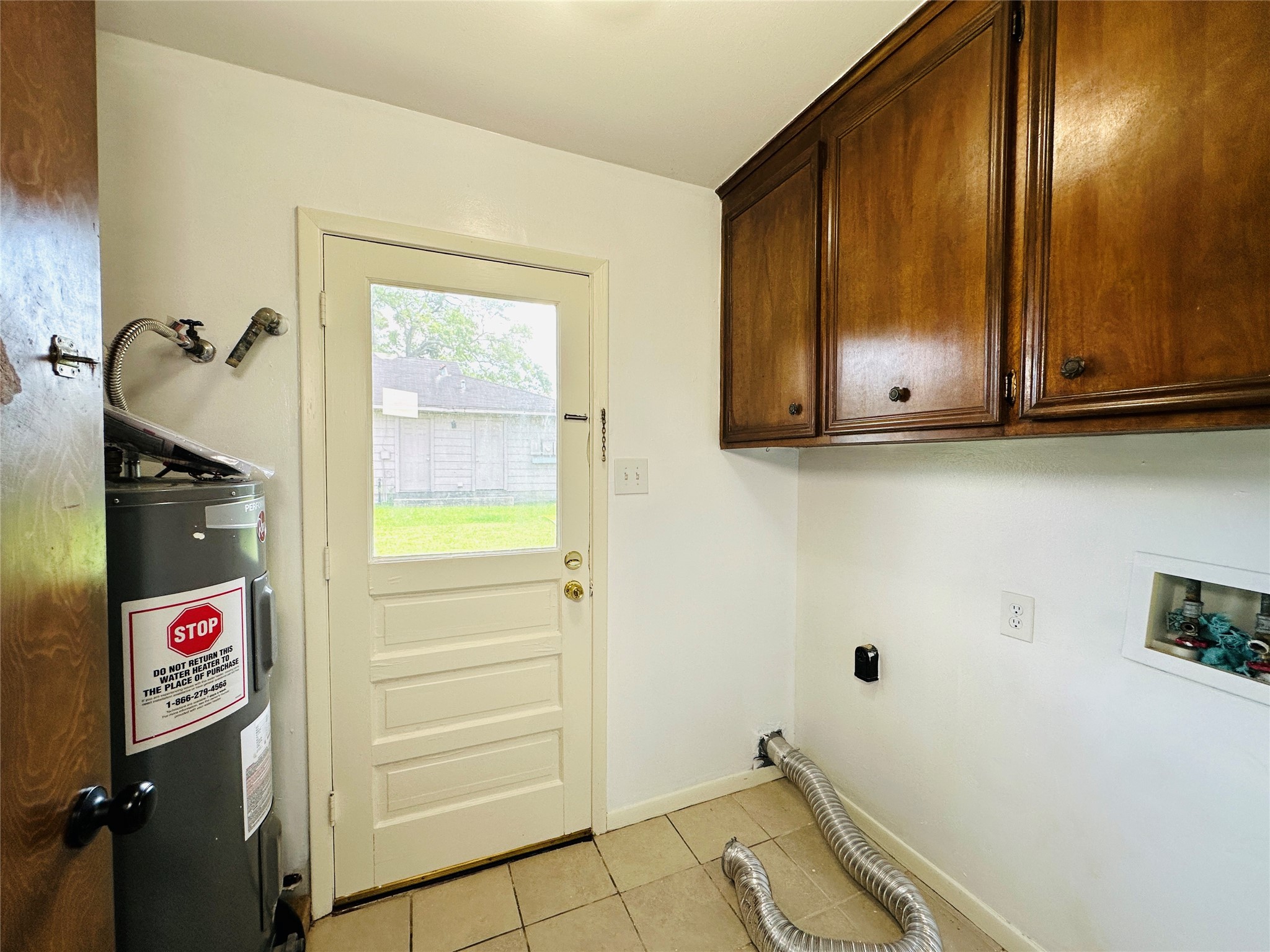 1011 Mccall Avenue Conroe, TX 77301 - Photo 8 of 15 a view of an entryway with wooden cabinet