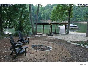 15131 Birling Road Charlotte, NC 28278 - Photo 11 of 12 a backyard of a house with table and chairs