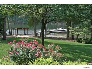15131 Birling Road Charlotte, NC 28278 - Photo 9 of 12 a view of a garden with flowers and trees