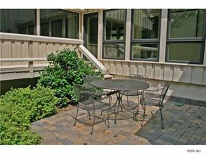 15131 Birling Road Charlotte, NC 28278 - Photo 10 of 12 a view of a chair and table in the backyard