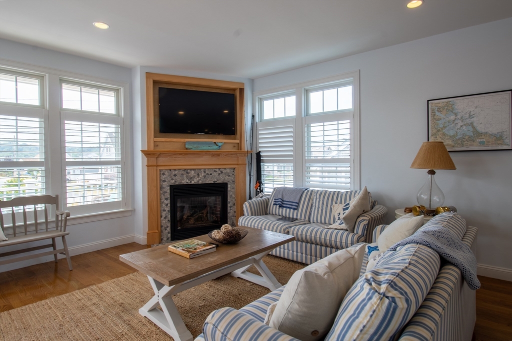 117 River Street Scituate, MA 02050 - Photo 3 of 23 a living room with furniture window and a fireplace