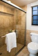 2650 Greenwood Terrace, Unit 125 Boca Raton, FL 33431 - Photo 11 of 25 a bathroom with a toilet and a shower