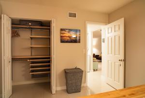 2650 Greenwood Terrace, Unit 125 Boca Raton, FL 33431 - Photo 13 of 25 a view of a livingroom with wooden floor and closet