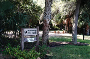2650 Greenwood Terrace, Unit 125 Boca Raton, FL 33431 - Photo 22 of 25 a sign that is sitting in the grass