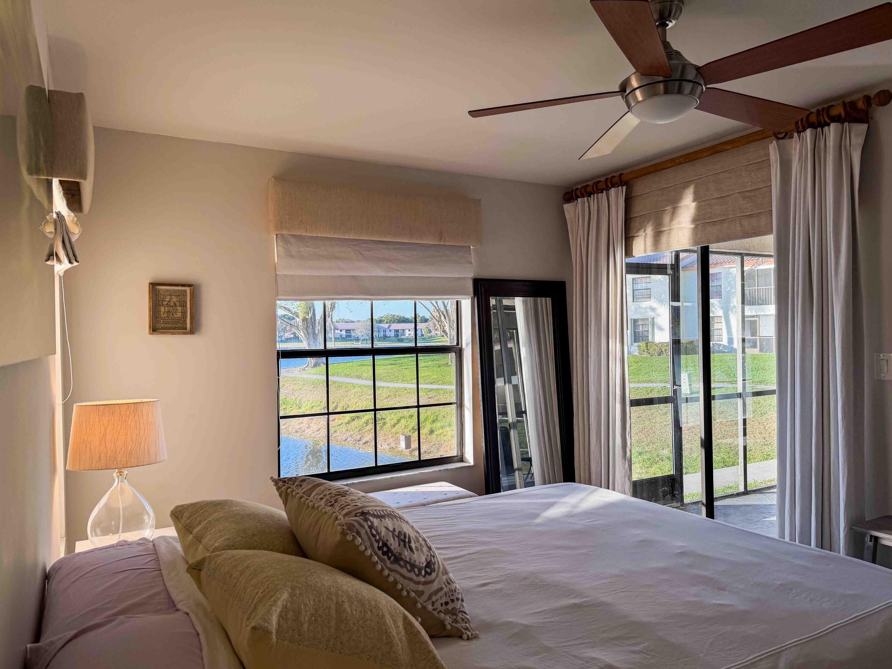 2650 Greenwood Terrace, Unit 125 Boca Raton, FL 33431 - Photo 5 of 25 a bed sitting in a bedroom next to a window