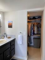 2650 Greenwood Terrace, Unit 125 Boca Raton, FL 33431 - Photo 8 of 25 a bathroom with a sink and a mirror