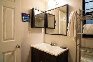 2650 Greenwood Terrace, Unit 125 Boca Raton, FL 33431 - Photo 9 of 25 a bathroom with a sink and a mirror
