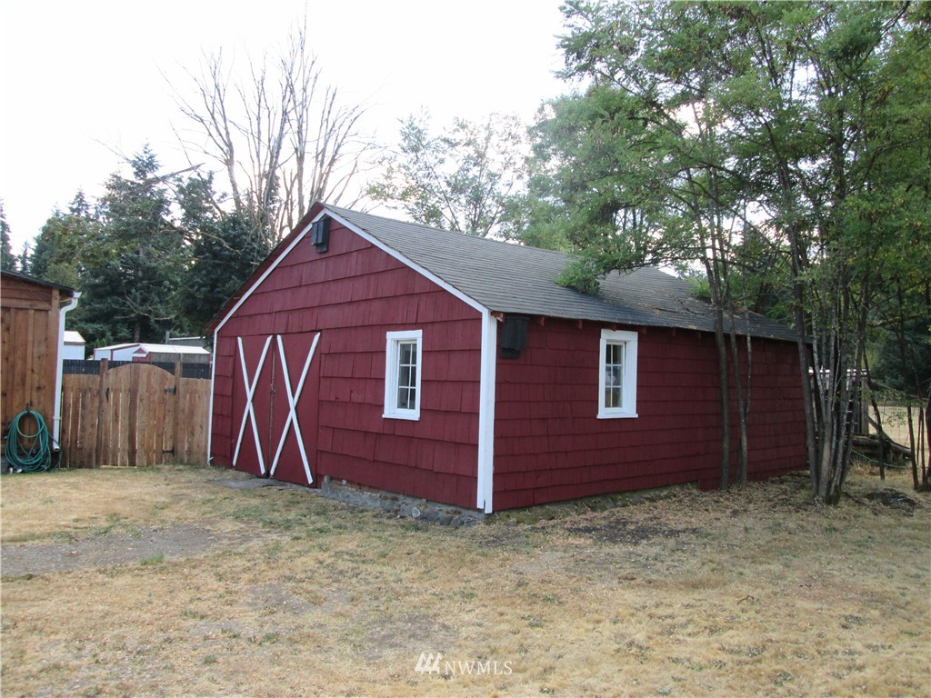 19039 Loganberry Street Southwest Rochester, WA 98579 - Photo 5 of 25 a house view with a backyard space