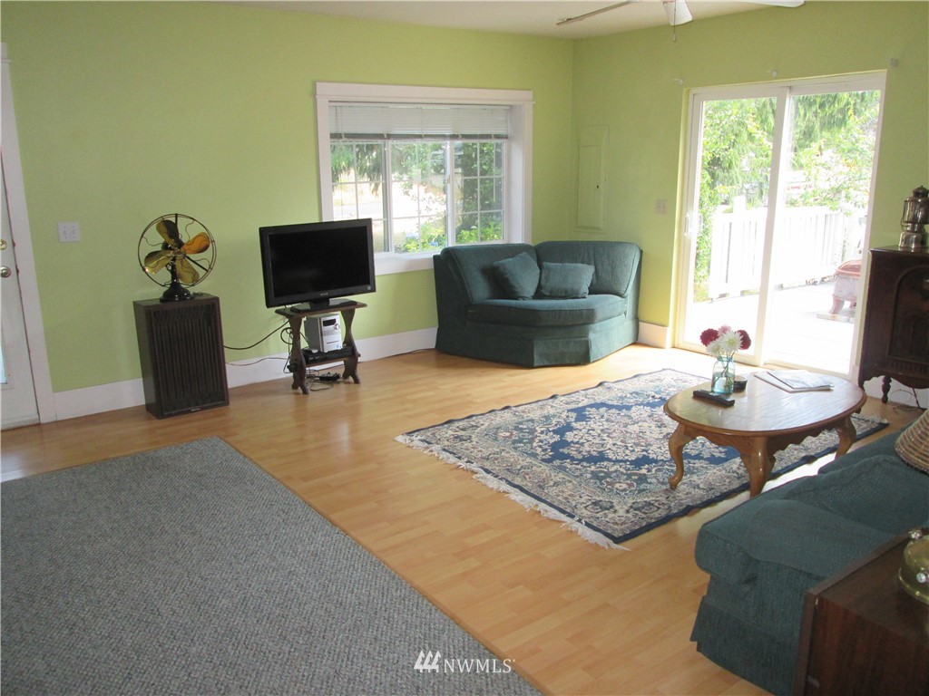 19039 Loganberry Street Southwest Rochester, WA 98579 - Photo 6 of 25 a living room with furniture and a flat screen tv