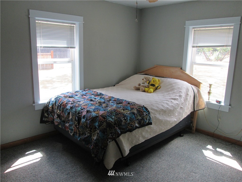 19039 Loganberry Street Southwest Rochester, WA 98579 - Photo 10 of 25 a bedroom with a bed and window