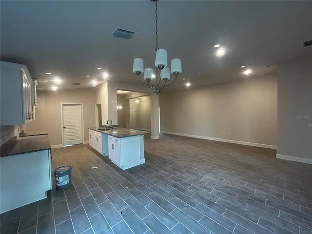 a view of a kitchen and dining room