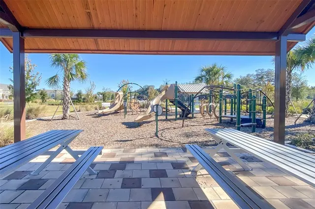 a view of swimming pool with a patio