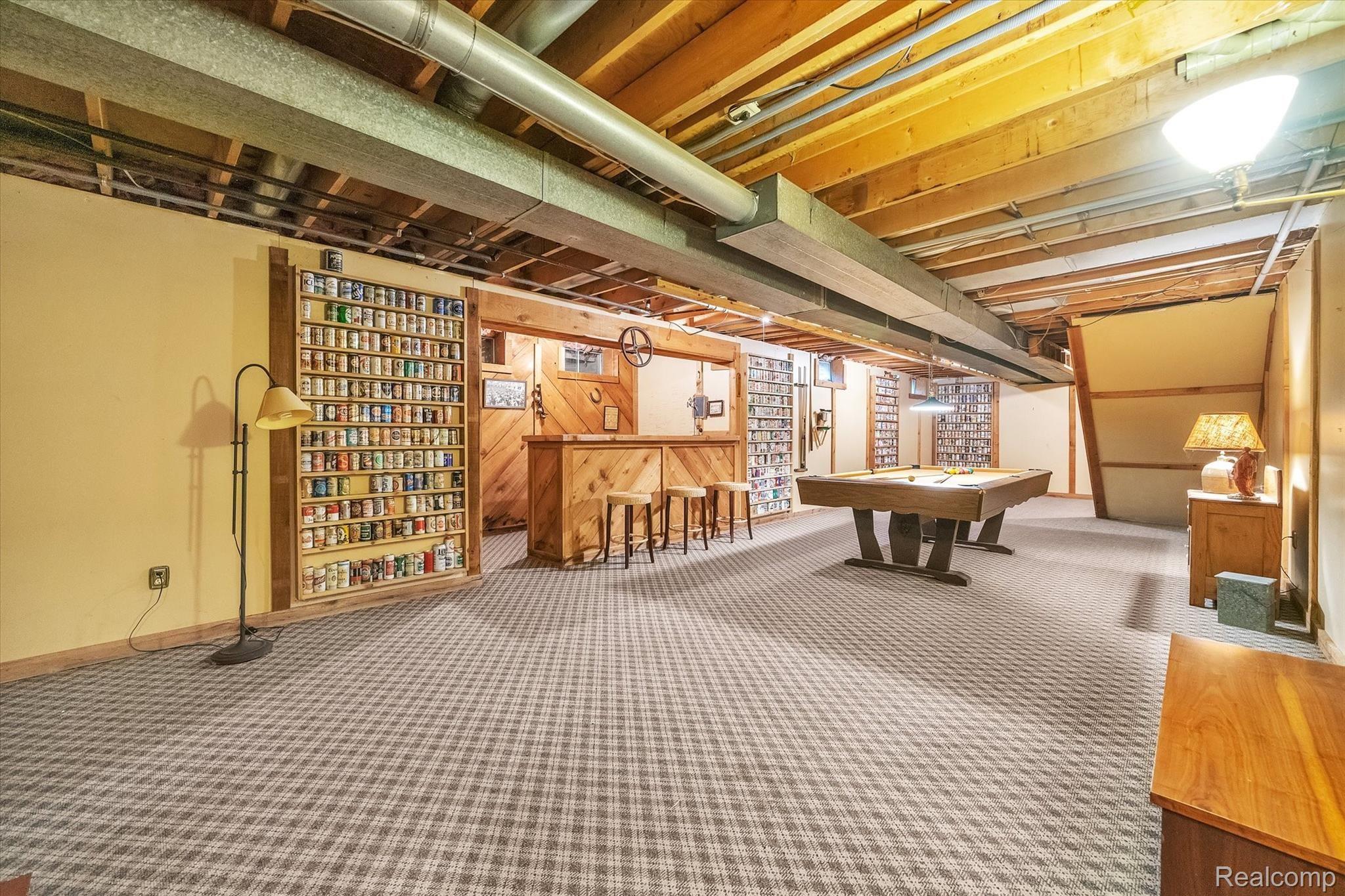 3073 Gentry Road Howell, MI 48843 - Photo 35 of 57 Basement rec area with bar