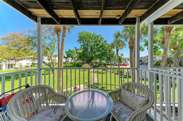 a view of a chair and table in balcony