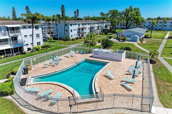 an aerial view of a house with outdoor space