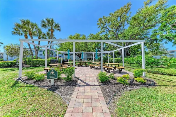 a view of a chair and tables in the garden