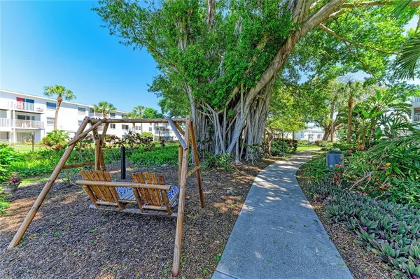 a backyard view with a seating space