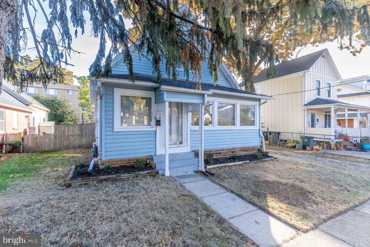 415 South Adams Street Arlington, VA 22204 - Photo 2 of 36 a view of a house with a yard and large tree