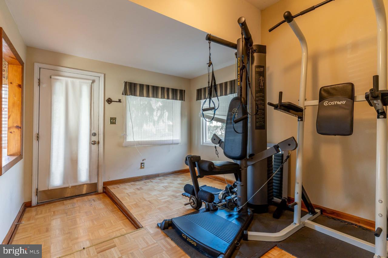 415 South Adams Street Arlington, VA 22204 - Photo 22 of 36 a room with gym equipment and windows
