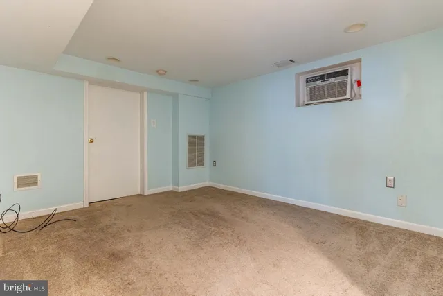a view of a livingroom with an empty space and workspace