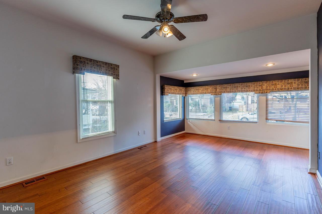 415 South Adams Street Arlington, VA 22204 - Photo 7 of 36 a view of an empty room with wooden floor and a window