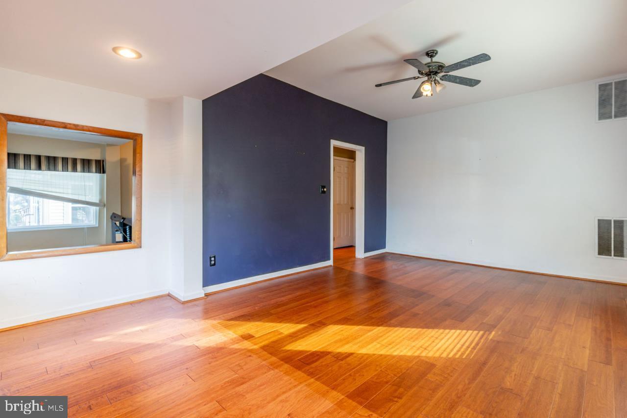 415 South Adams Street Arlington, VA 22204 - Photo 10 of 36 a view of an empty room with wooden floor and a window