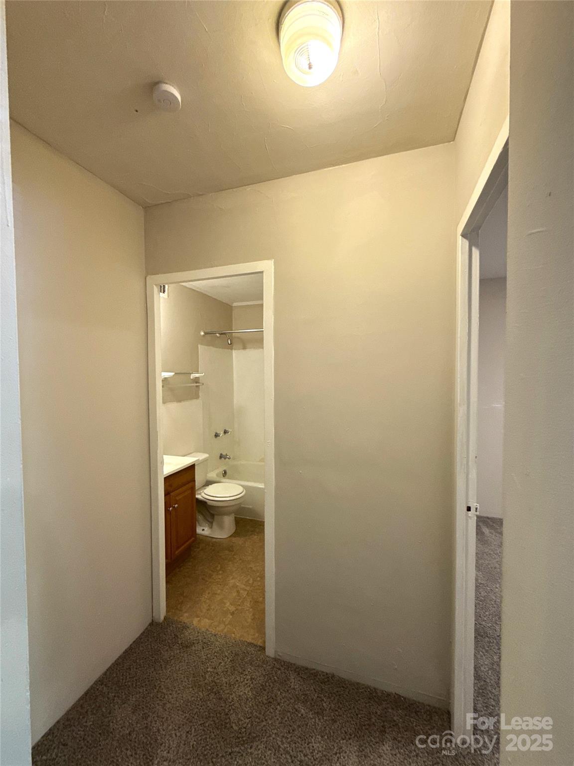 2126 East 7th Street, Unit 107 Charlotte, NC 28204 - Photo 5 of 8 a bathroom with a sink and a toilet