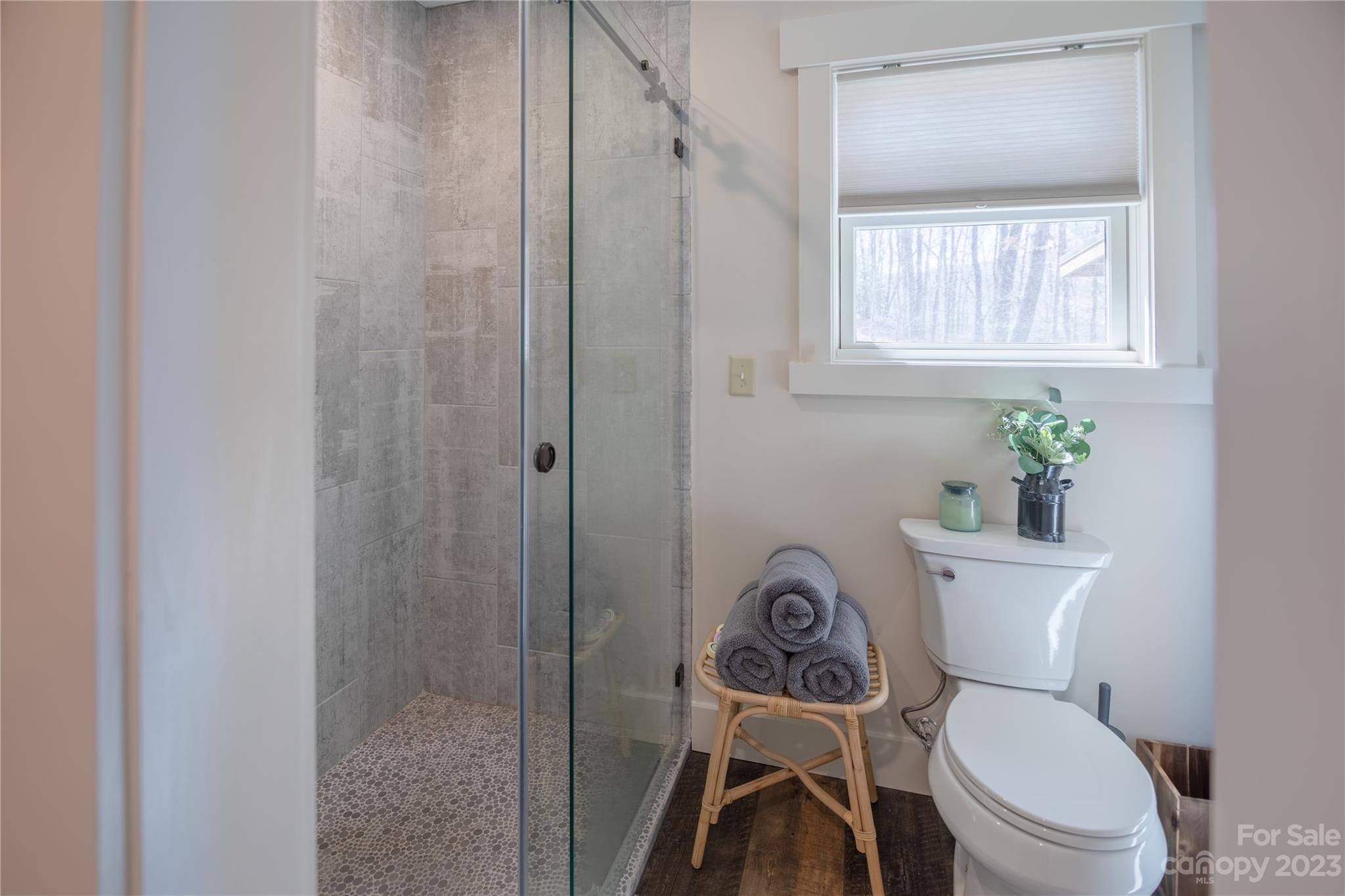 853 Cardinal Road Brevard, NC 28712 - Photo 11 of 28 a white toilet sitting next to a bathroom sink
