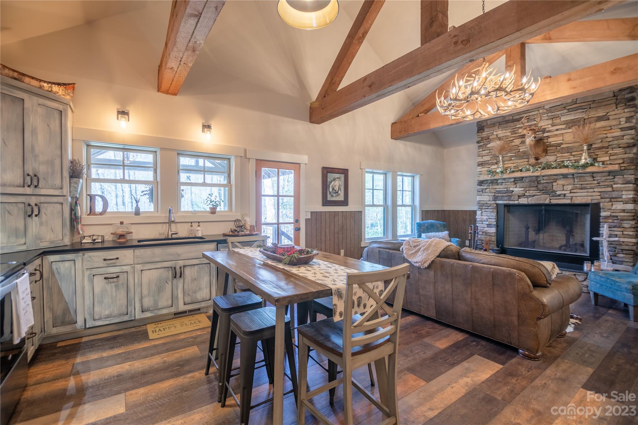 853 Cardinal Road Brevard, NC 28712 - Photo 3 of 28 a view of a dining room with furniture window and wooden floor