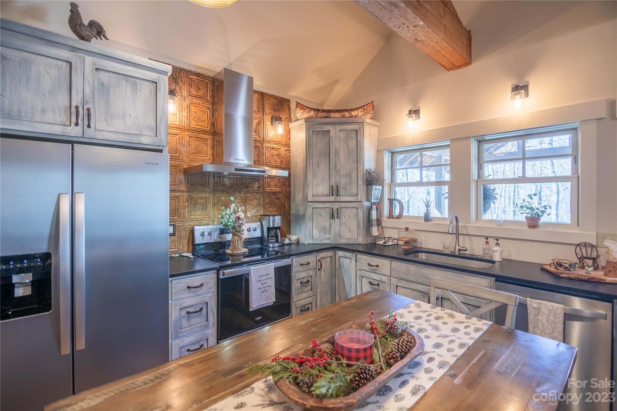 853 Cardinal Road Brevard, NC 28712 - Photo 6 of 28 a kitchen with stainless steel appliances granite countertop a sink stove and refrigerator