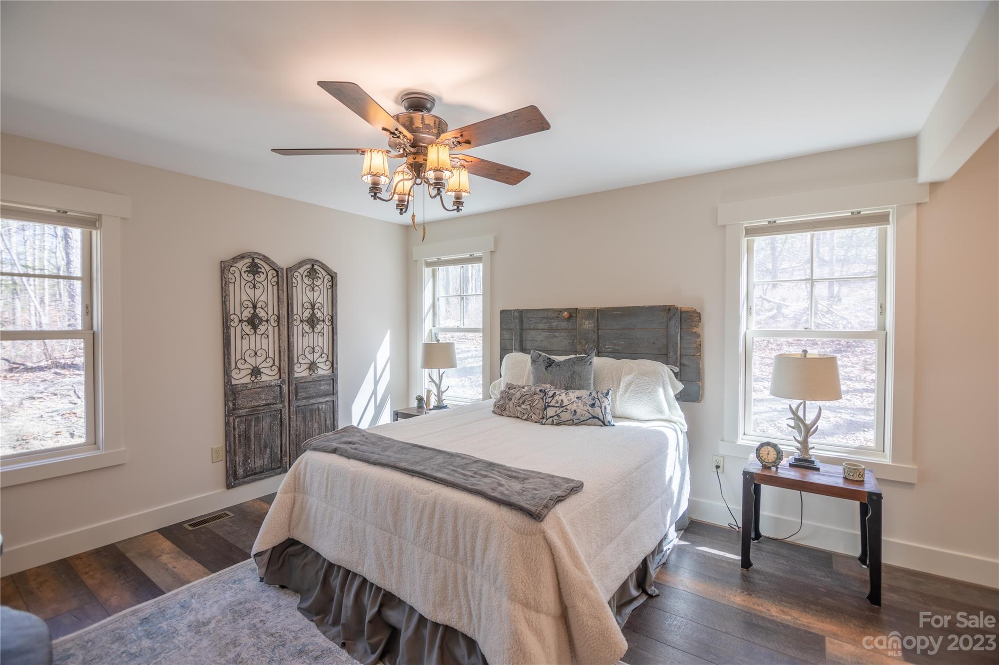 853 Cardinal Road Brevard, NC 28712 - Photo 8 of 28 a bedroom with a bed and a chandelier