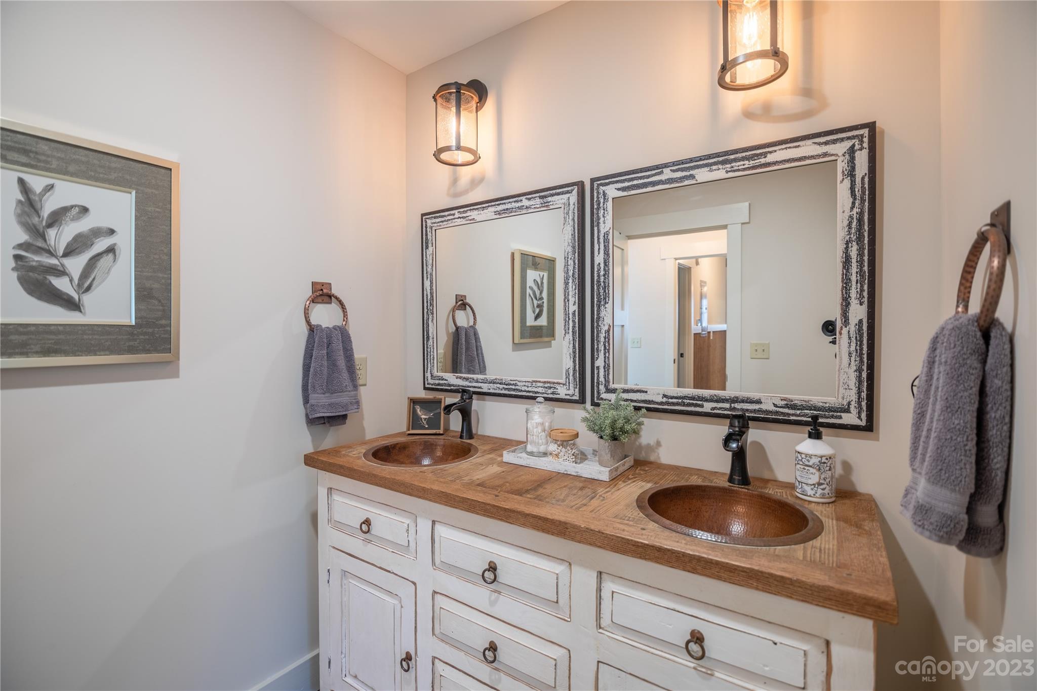 853 Cardinal Road Brevard, NC 28712 - Photo 10 of 28 a bathroom with a sink and a mirror